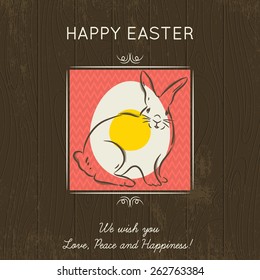 Hand painted easter egg in the green square. Brown wooden background and greetings inscription Happy Easter. Card for Easter. Decorative composition suitable for invitations, greeting cards