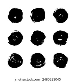 Hand painted ink blobs form a circle on a white background