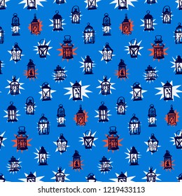 Hand painted lantern with candle isolated on blue background. Seamless pattern.