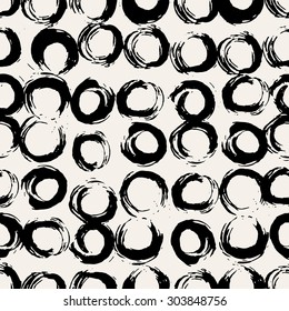Hand painted round brush strokes seamless pattern. Hand drawn chaotic ink circles. Expressive monochrome strokes. Black and white vector illustration.