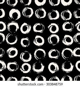 Hand painted round brush strokes seamless pattern. Hand drawn chaotic ink circles. Expressive monochrome strokes. Black and white vector illustration.