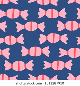 Hand painted seamless pattern with candies in red and pastel pink on blue background.