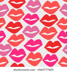 Hand painted seamless pattern with lips in red and pink on white background.