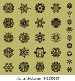 Hand painted sketch. Vector set of abstract hand drawn snowflakes maked on a neutral background.