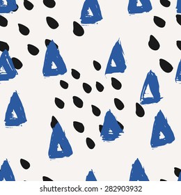 Hand painted triangles and brush strokes in blue and black. Seamless abstract repeat watercolor background.