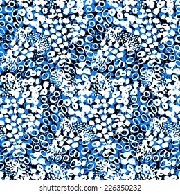 Hand painted vector seamless pattern with ethnic and tribal motifs, splatters and brushstrokes in bright blue, white and black colors for summer spring fashion