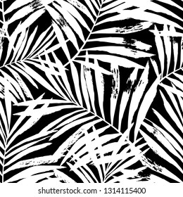 Hand painted white vector palm leaves seamless pattern on black background. Perfect for fabric, wallpaper or wrapping paper.