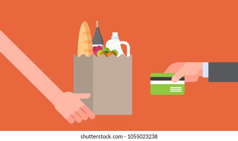 Hand Paying For Paper Bag Full Of Grocery Products With Credit Card, Online Food Order And Delivery Service Concept