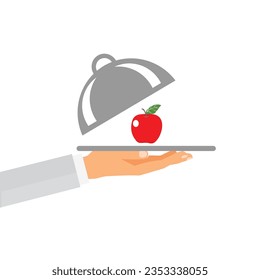 Hand of a person holding a tray with a cloche and an apple  