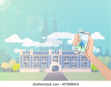 hand with the phone with game on the background of the city