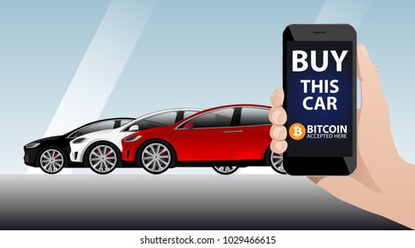 Hand with phone on the background of cars. On the screen of the device the inscription "Buy this car" and "Bitcoin accepted here"