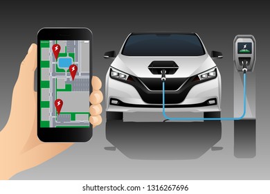 A hand with a phone on the background of a charging electric car. On the screen is a map with the location of the charging stations.