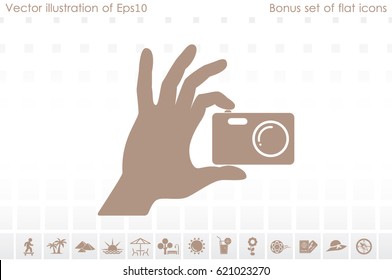 Hand and photo camera icon vector