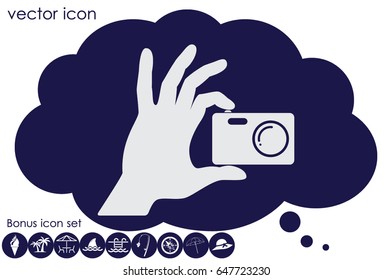 Hand and photo camera icon vector