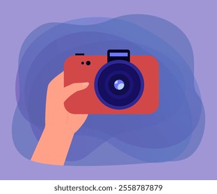 Hand of photographer holding red camera. Person buying camera or taking photo flat vector illustration. Photography, hobby, memories concept for banner, website design or landing web page