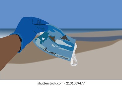 Hand Picking Up The Face Mask Garbage On The Beach