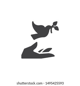 Hand and pigeon vector icon. filled flat sign for mobile concept and web design. Dove with olive branch and hand glyph icon. Freedom and peace symbol, logo illustration. Vector graphics