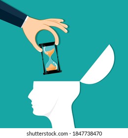 The hand placed an hourglass inside the head. Time concept. Vector illustration