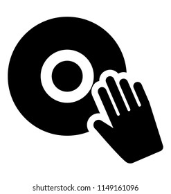 
A hand placed on a large disk to turn on music, dj turntable 
