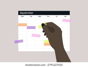 A hand places vibrant sticky notes onto a calendar, marking important dates and organizing tasks for the week ahead, emphasizing a creative approach to scheduling.