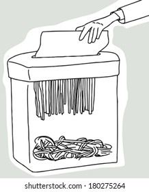 Hand placing document in document shredder on gray background