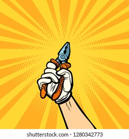 hand with pliers, work tool. Comic cartoon pop art retro vector illustration drawing