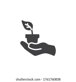 Hand with potted plant vector icon. filled flat sign for mobile concept and web design. Hand holding house plant glyph icon. Symbol, logo illustration. Vector graphics
