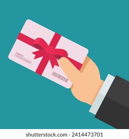 A hand presents a gift card with a red ribbon with a bow in flat design style on blue background