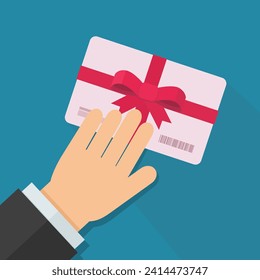 A hand presents a gift card with a red ribbon with a bow in flat design style on blue background