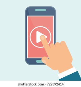 Hand presses play video button on mobile smartphone