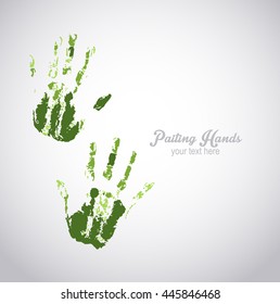 Hand prints with green paint