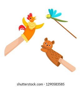Hand puppets dolls cock, bear and dragonfly. Theater children's play.