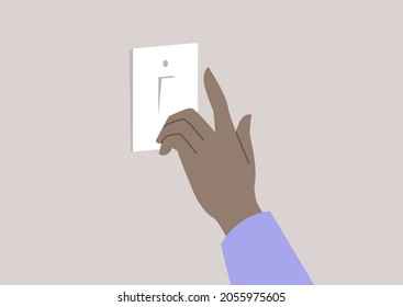 Una mano presionando un botón y encendiendo la electricidad