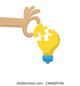 Hand put a part of light bulb puzzle, idea concept