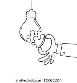 Hand put a part of light bulb puzzle, idea concept