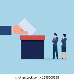 Hand put vote paper in to the box while people are queuing up.