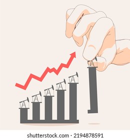 Hand puts another bar in the oil growth chart