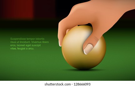 Hand puts the ball on the billiard table