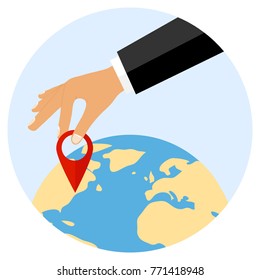 The hand puts a mark on the planet Earth. Put a mark on the map. Flat design, vector illustration, vector.