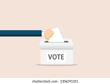 Hand puts voting ballot in ballot box. Voting and election concept