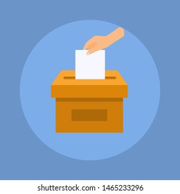 Hand puts voting ballot in ballot box. Election concept.