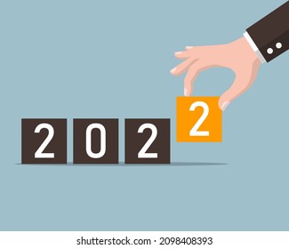 hand putting box for 2022 years. business start to year 2022. happy new years goal concept. vector illustration in flat style modern design.