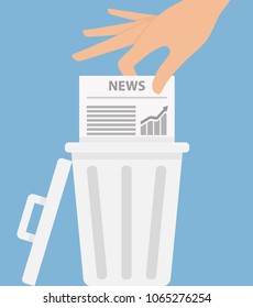 Hand putting business newspaper into the trash can