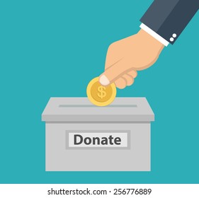 Hand putting coin in the donation box