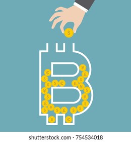 Hand putting coin into coin box in the form of bitcoin symbol, crypto currency concept