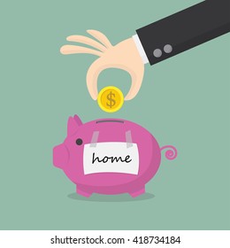 hand putting coin into the piggy money box,save money for home