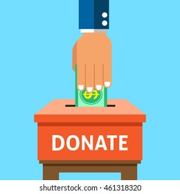 Hand putting money in the donation box