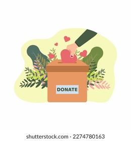 Mano poniendo forma rosada al corazón en la caja de donaciones. Caridad para la humanidad