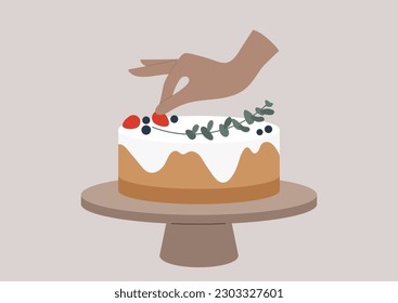 A hand putting a red sweet strawberry on top of a cake with vanilla icing