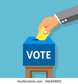 Hand putting voting paper in the ballot box